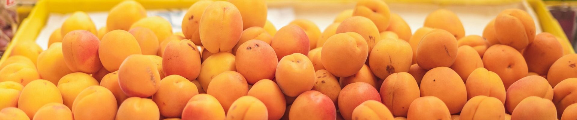 pexels-photo-8446840-8446840 A vibrant display of organic apricots at a local market showcasing healthy produce.